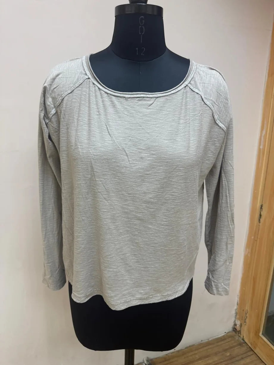 The Grey Lane Beige relaxed long-sleeve tee — original garment photograph